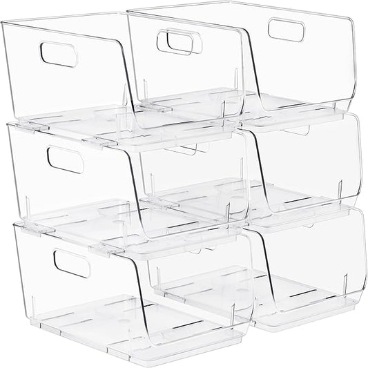 Stack of clear plastic storage bins with handles on a white background